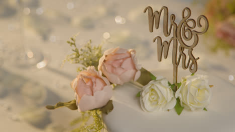 Close-Up-Of-Wedding-Cake-On-Decorated-Table-At-Wedding-Reception-2